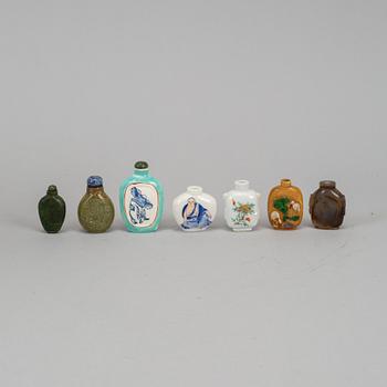 A group of seven stone, ceramic and porcelain snuff bottles, Qing dynasty and China, 19th-20th century.
