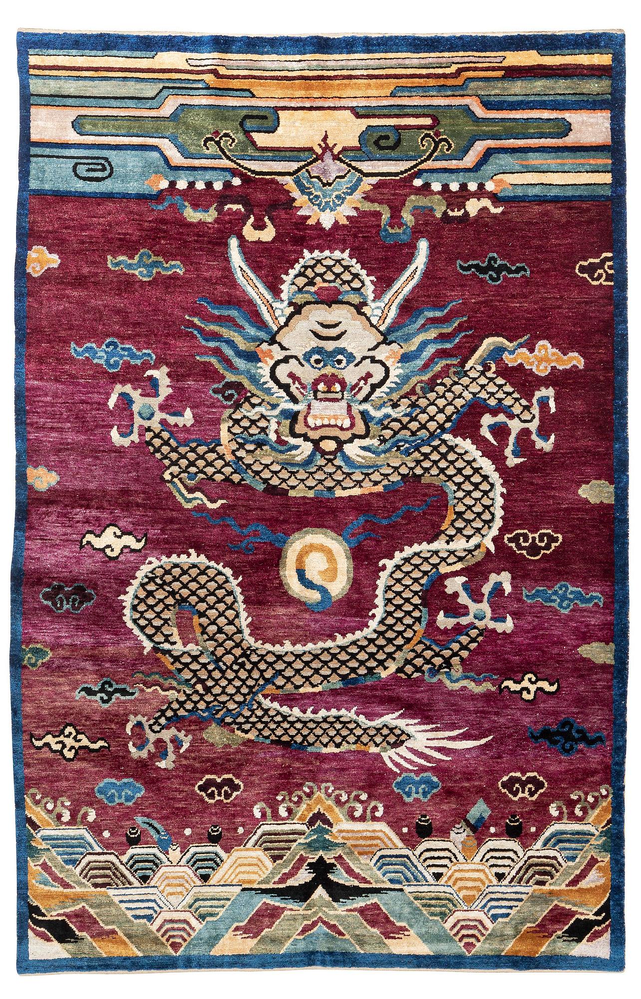 A Chinese silk and metal-thread 'Dragon' pillar rug, Bejing, North China, around 1910, c. 234x151 cm.