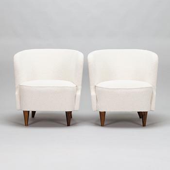 A pair of mid-20th-century armchairs.