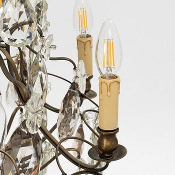 Takkrona, rokokostil, 1900-talets första hälft.