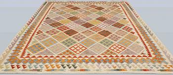 A Kelim carpet, 342 x 270 cm.