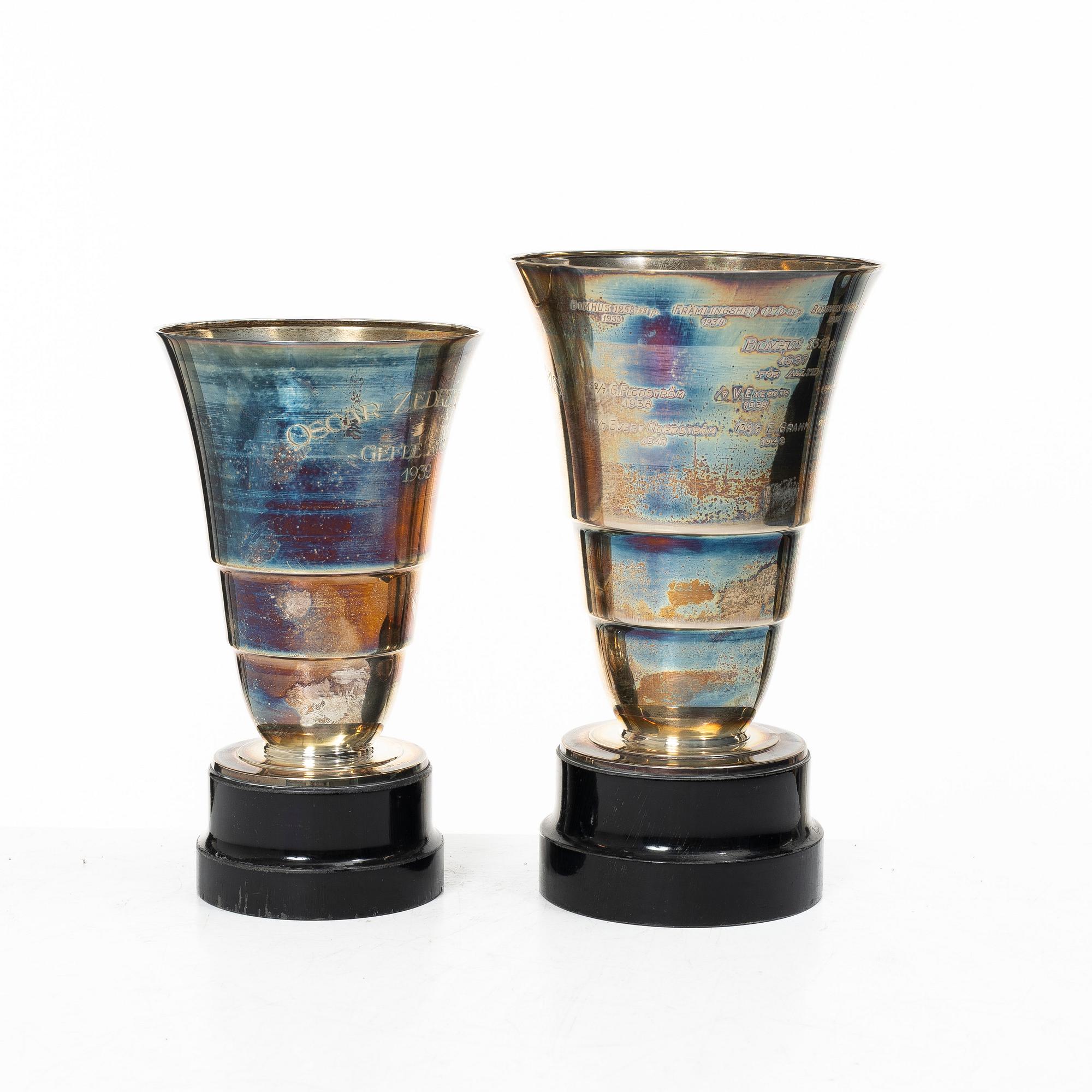 Guldsmedsaktiebolaget (GAB), Two silver vases on wooden bases, Stockholm 1931-1933.