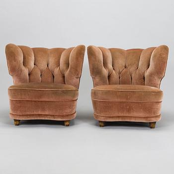 A pair of mid 20th century armchairs.