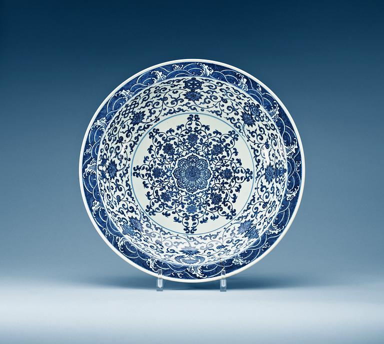 A large blue and white charger, Qing dynasty with Yongzheng six character mark.