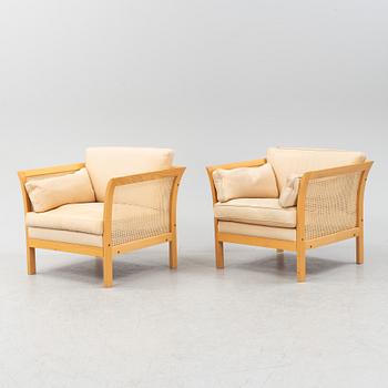 A pair of 'Rotan' easy chairs by Arne Norell, end of the 20th Century.