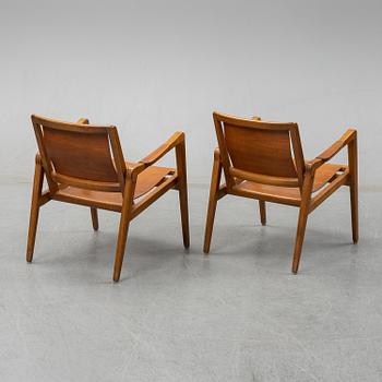 Axel Larsson, A pair of Swedish Bodafors armchairs, mid 20th century.