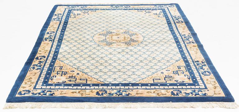 A carpet, China, antique finish, ca 275 x 185 cm.