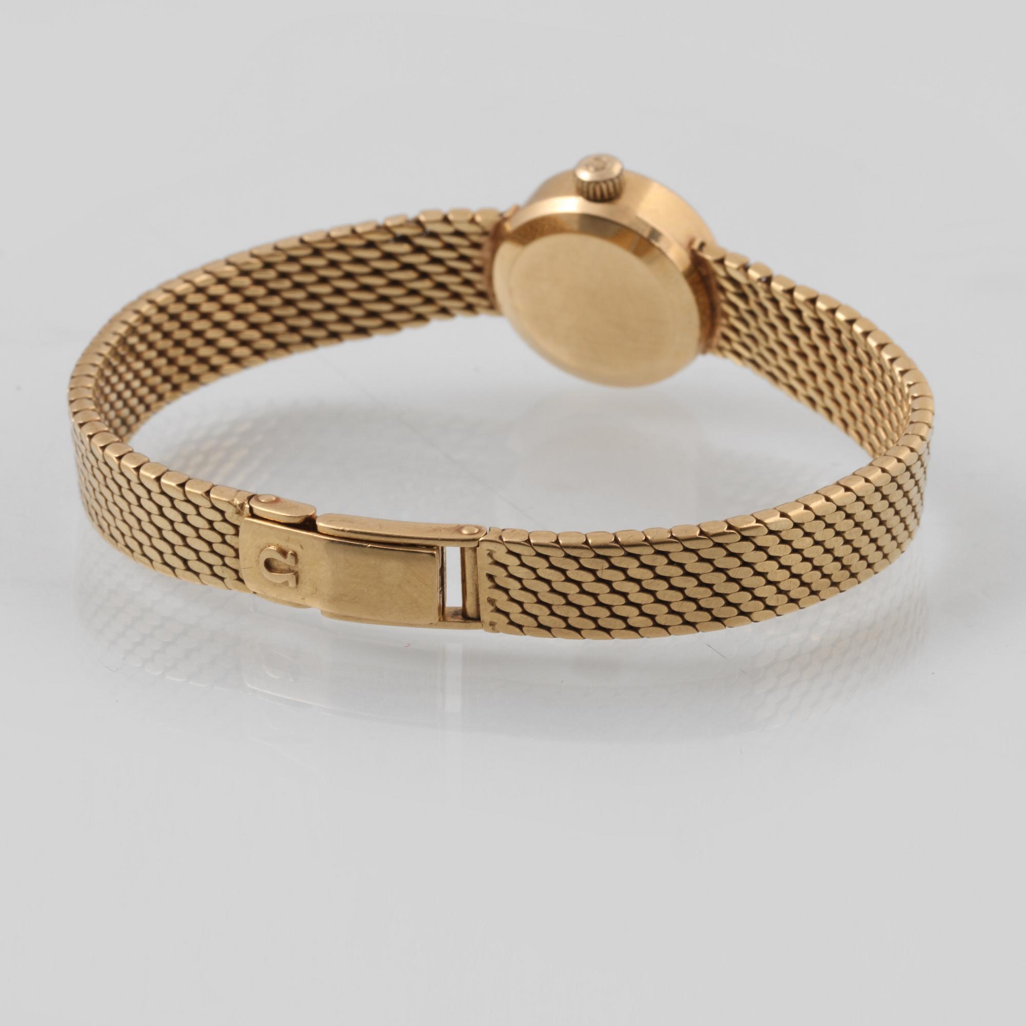 DAMARMBANDSUR, 18K guld, Omega. Vikt 44,6 gram.