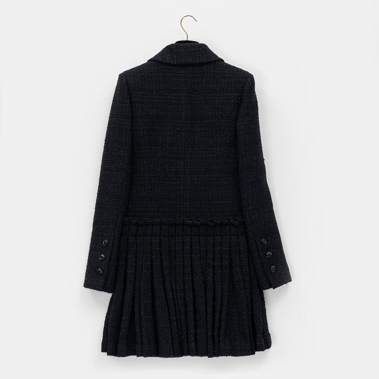 Chanel, a bouclé coat, size 34.