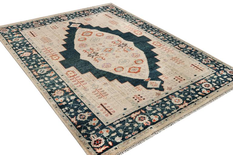 An oriental carpet with Mamluk design, c. 307 x 237 cm.