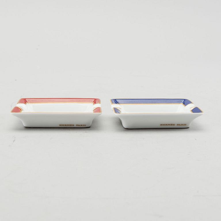 HERMÈS, a pair of porcelain ashtrays.