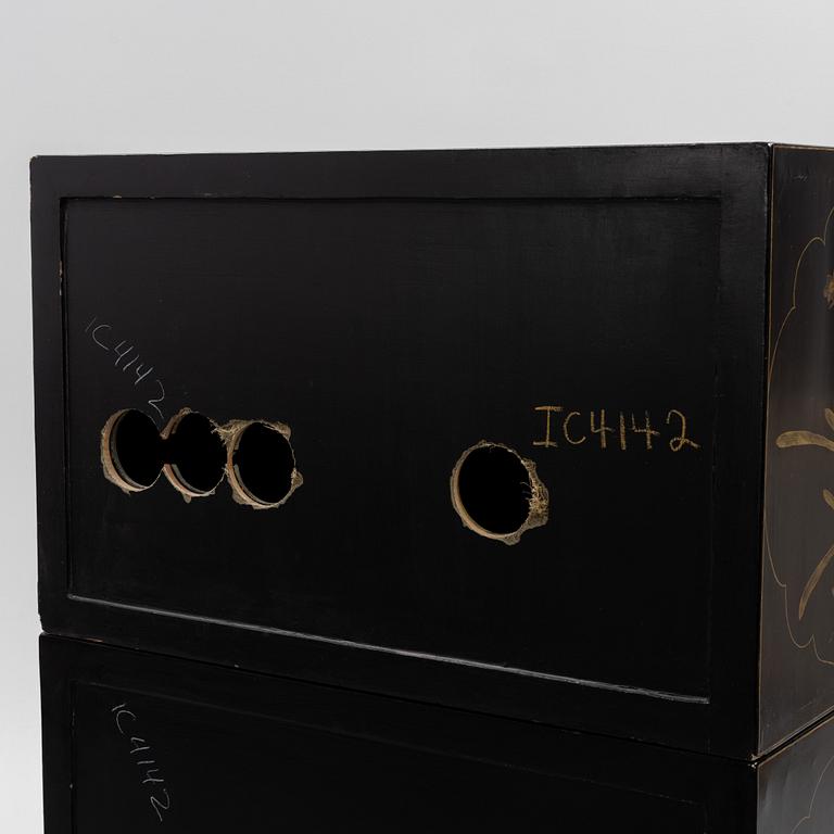 A Chinese lacquered two-part cabinet, first part of the 20th century.