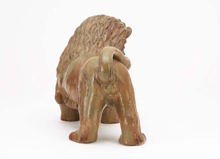 A Gunnar Nylund stoneware figure of a lion, Rörstrand.