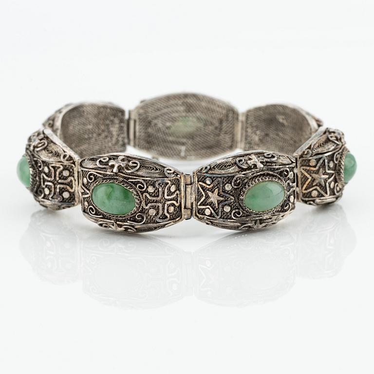 A Chinese silver and green stone bracelet and a pair of earrings, early 20th century.