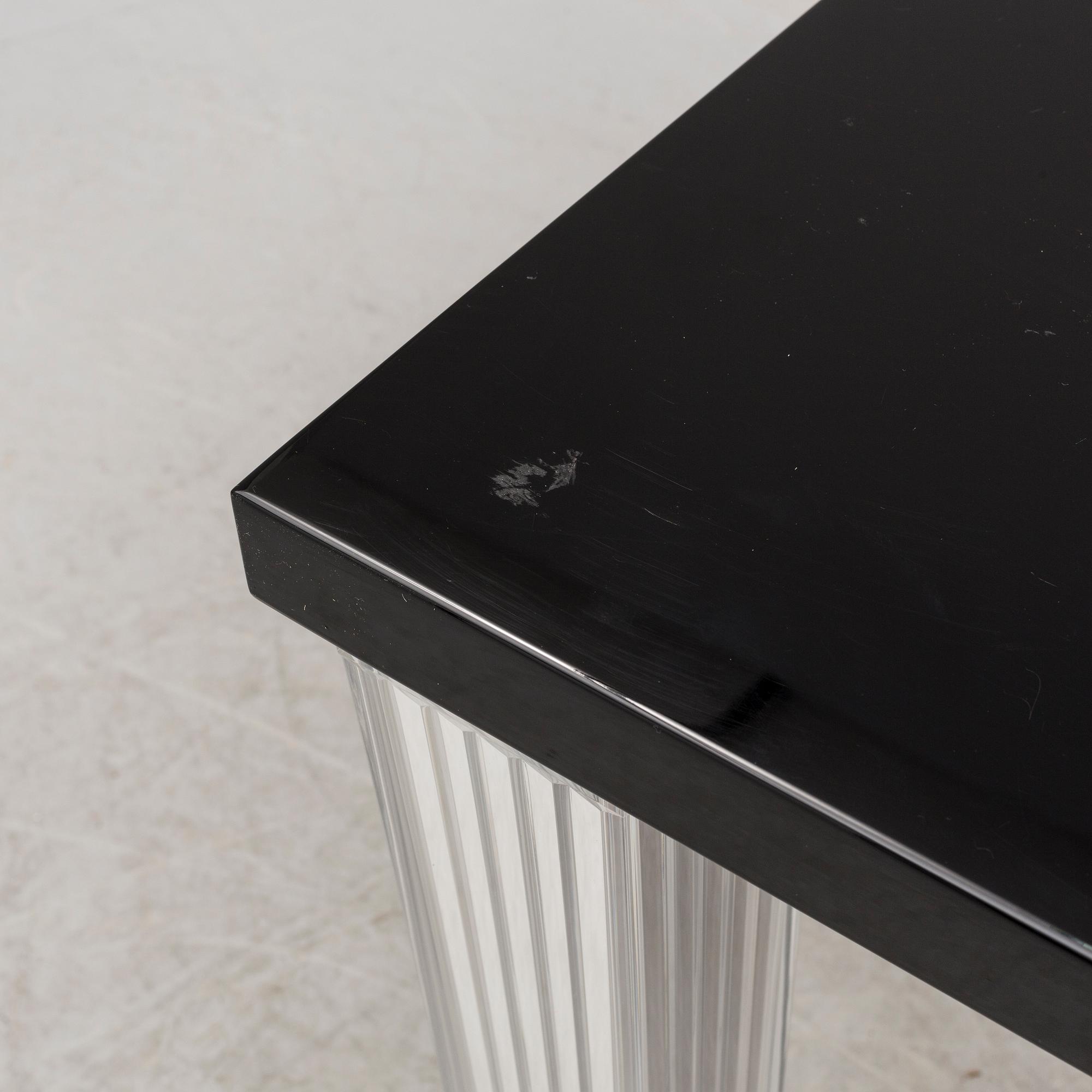 A "Tip Top" dining table by Philippe Starck for Kartell.