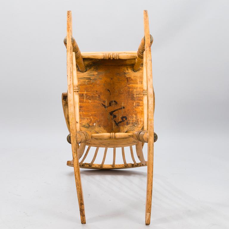 A Wooden Rocking Chair.