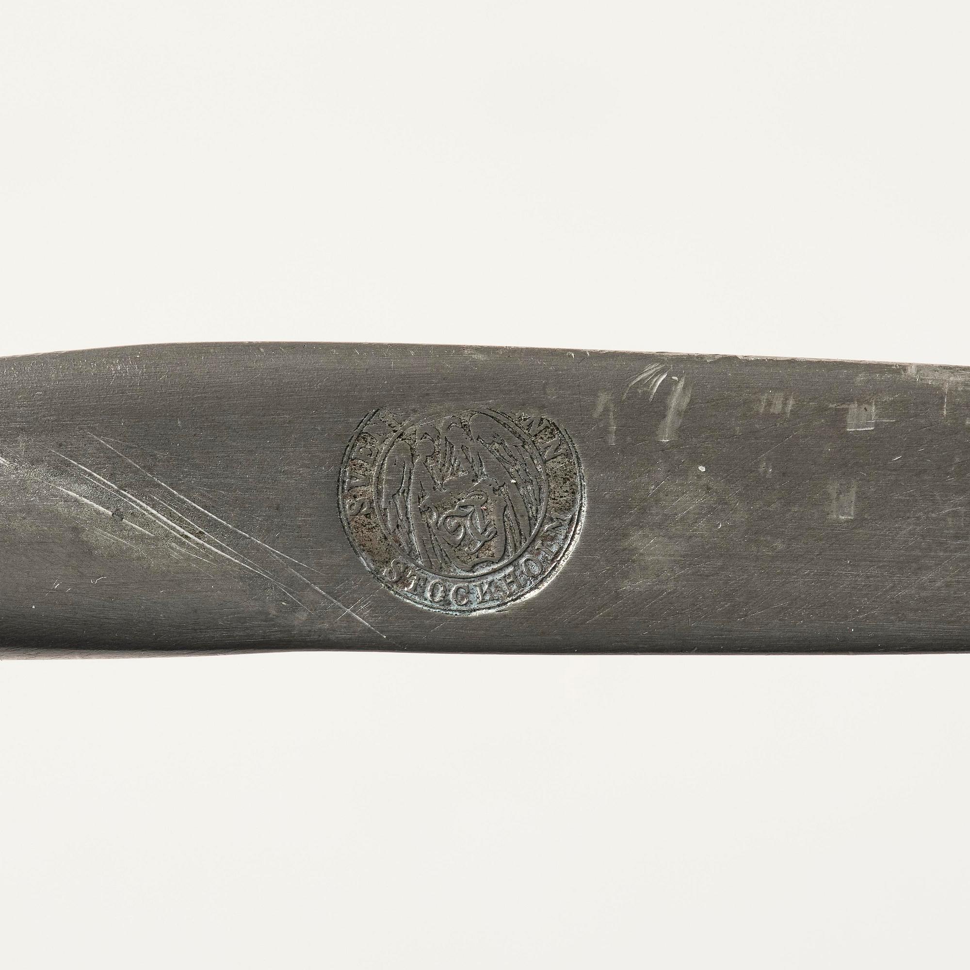Firma Svenskt Tenn, a pewter hand mirror model A 1497 and a letter opener in the shape of an alligator, Stockholm, 1930s-40s.