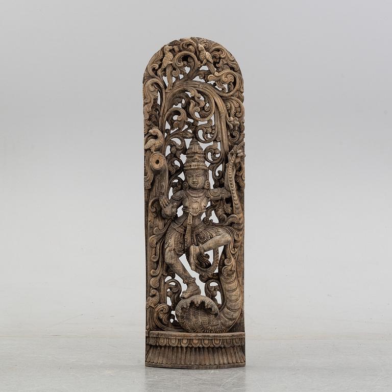 A carved wooden Shiva, India, around the year 1900.