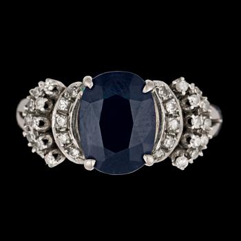135. A blue sapphire and diamond ring.