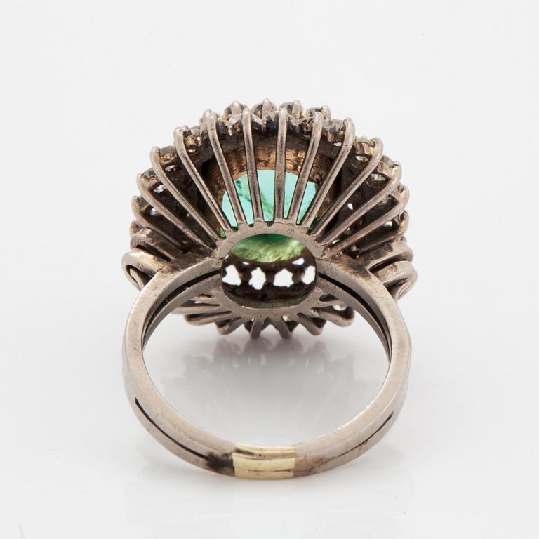 Emerald-cut emerald and eight-cut diamond ring.