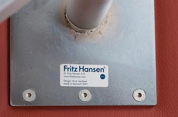 A pair of Arne Jacobsen red leather 'Swan' chairs, Fritz Hansen, Denmark 2001.