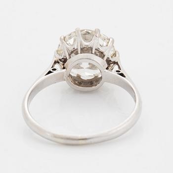 A platinum ring set with an old-cut diamond ca 3.30 cts quality ca J/K vs.