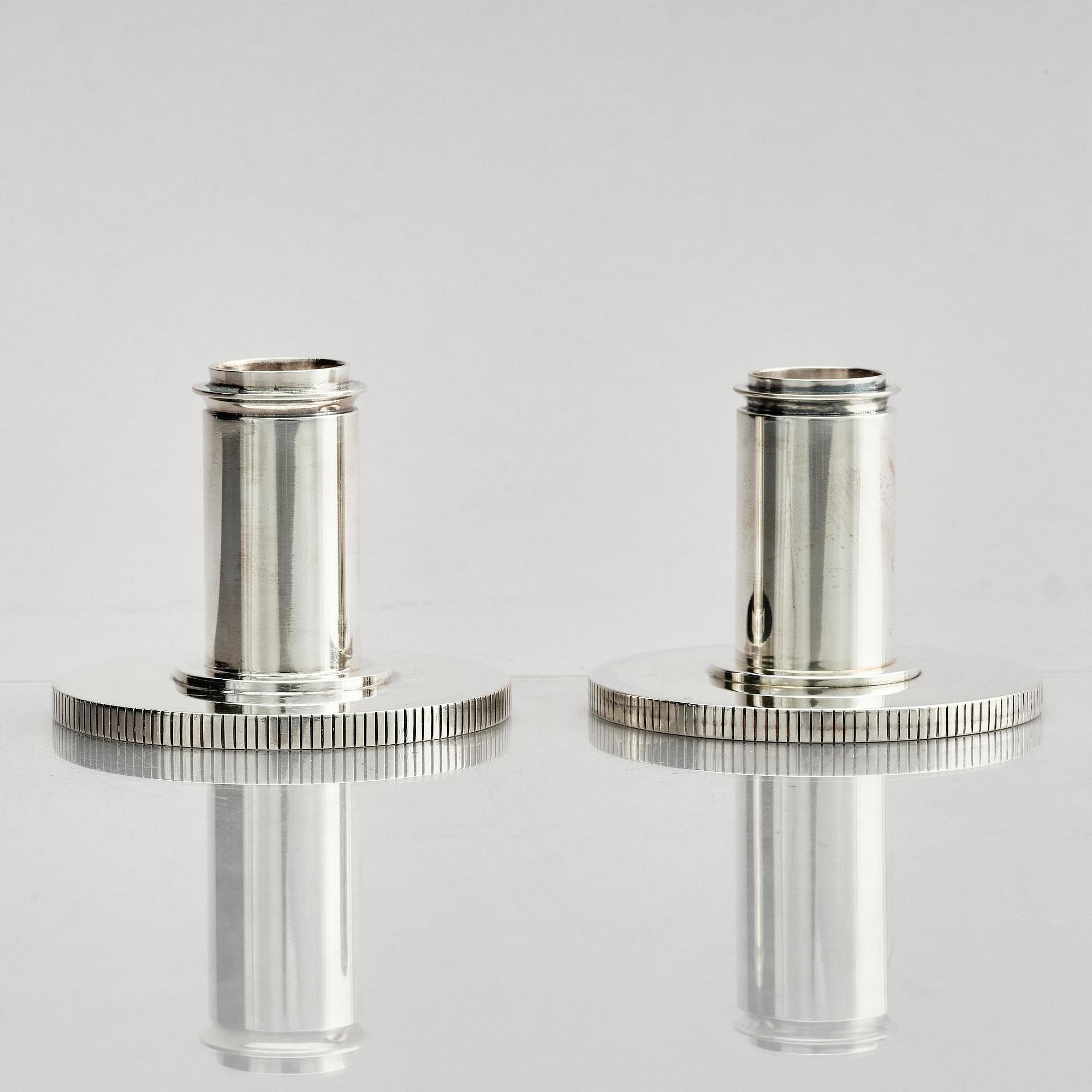 Georg Jensen, a pair of sterling silver candlesticks, design by Sigvard Bernadotte, model no 711A, Copenhagen, Denmark after 1945.