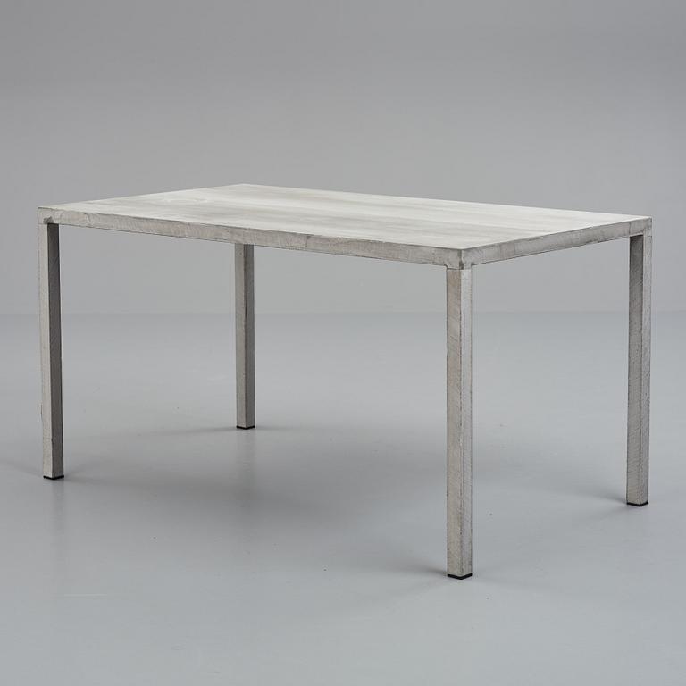 A concrete dining table, contemporary production.