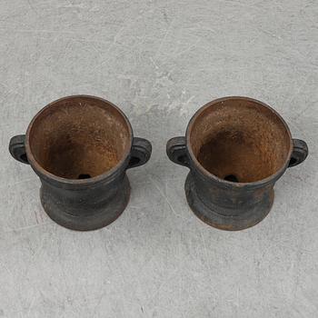 A 19th  century pair of cast iron flower pots.