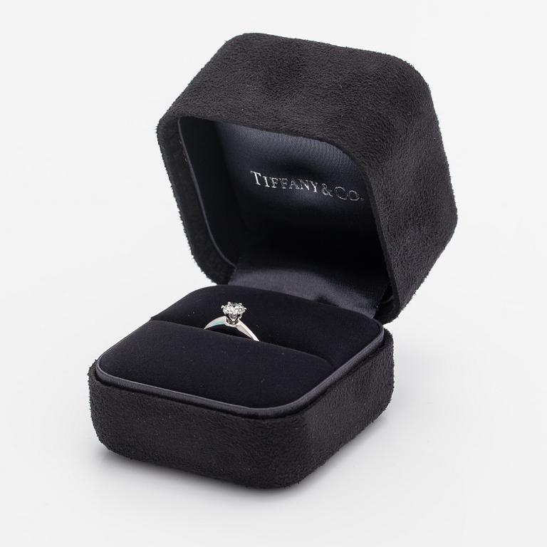 Tiffany & Co, A platinum ring with a ca. 0.55 ct diamond.