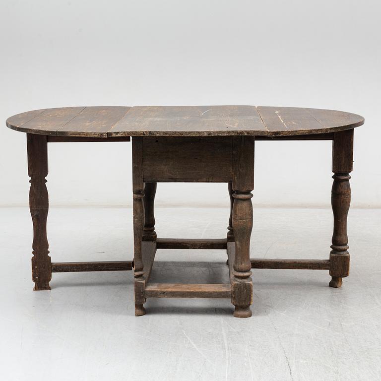 A Baroque-style gate leg table, 19th century.