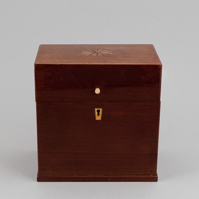 A late Empire mahogany box with three glass bottles, mid 19th Century.