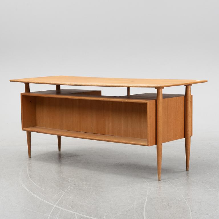 A teak veneered writing desk, 1950's/60's.