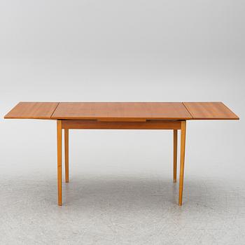 A mid20th century dining table.