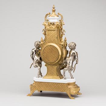 A LOUIS XVI STYLE GILT-BRASS CLOCK GRANITURE. Italy, SECOND HALF OF 20TH CENTURY.