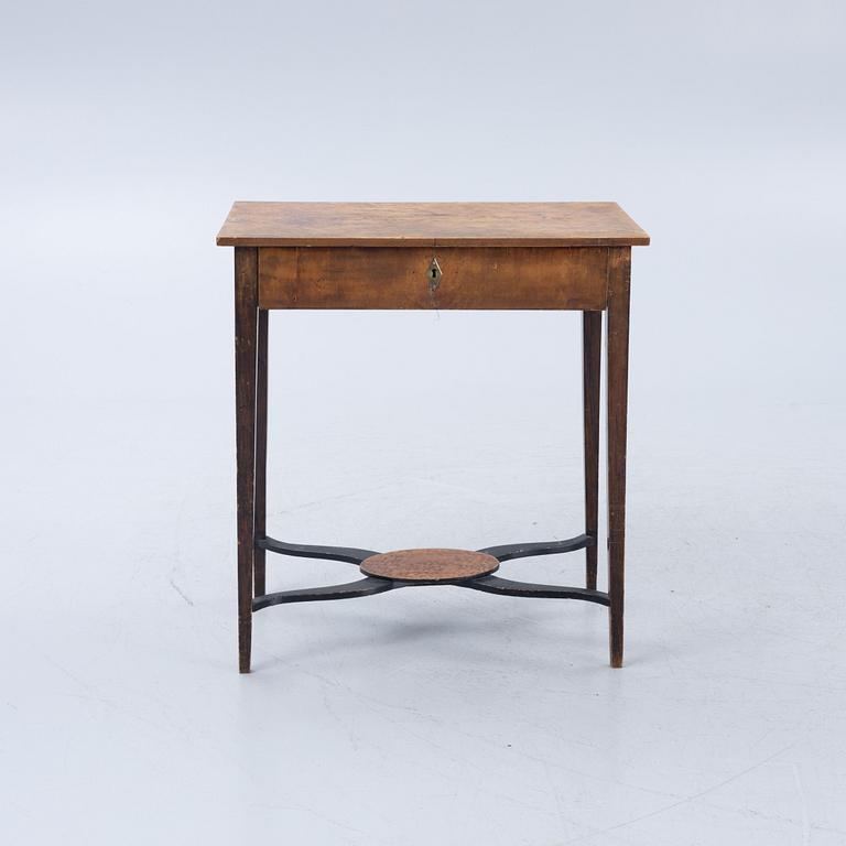 A late Gustavian burr-alder table, circa 1800.