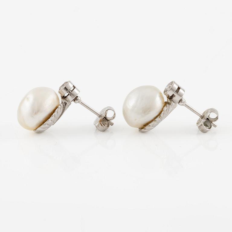 A pair of platinum earrings with bouton pearls and old-cut diamonds.