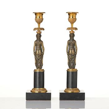 A pair of late Gustavian marble and ormolu candlesticks in the manner of F. L. Rung (1758-1837).