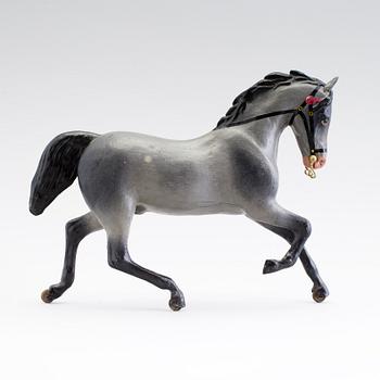 A painted tinplate toy horse ca year 1900.