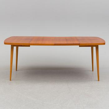 A 1950s teak and teak veneer table.