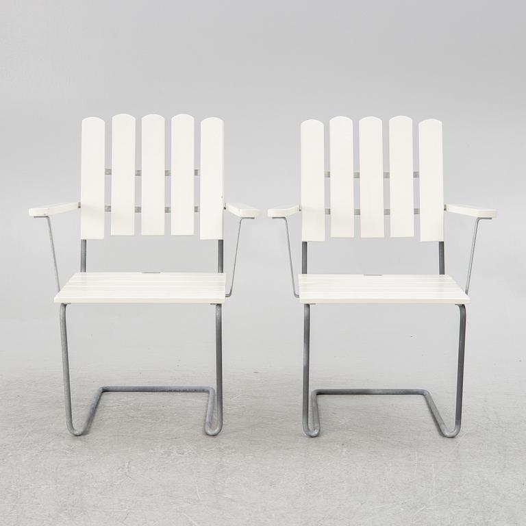 Arthur Lindquist, four armchairs model A2 and a table 9A, Grythyttan's steel furniture.