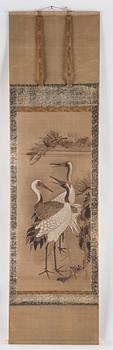 A scroll painting with cranes, signed Tsunenobu.