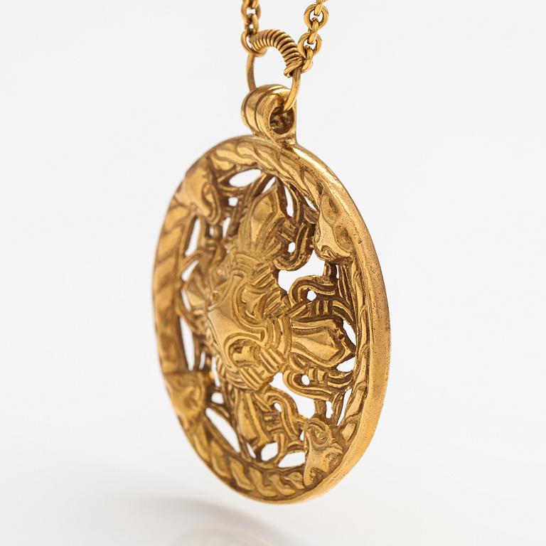 A gilded bronze neckalce "Åland pendant", model no. 67. Kalevala koru, Helsinki.