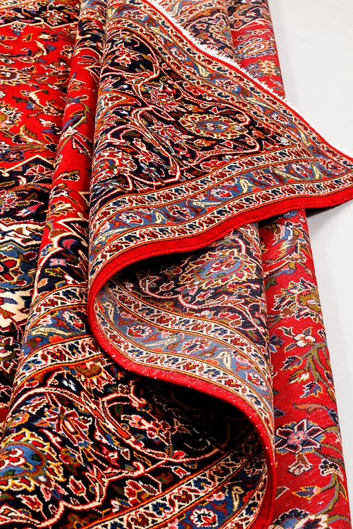 A Keshan rug, signed, 410 x 295 cm.