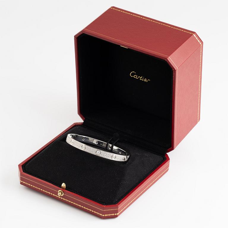 A Cartier "Love Pavé" in 18K white gold set with round brilliant-cut diamonds.