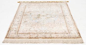 An oriental, silk rug, signed, c. 175 x 125 cm.
