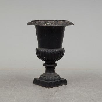 a 20th century cast iron garden urn.