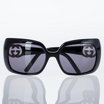 AURINKOLASIT, Gucci.