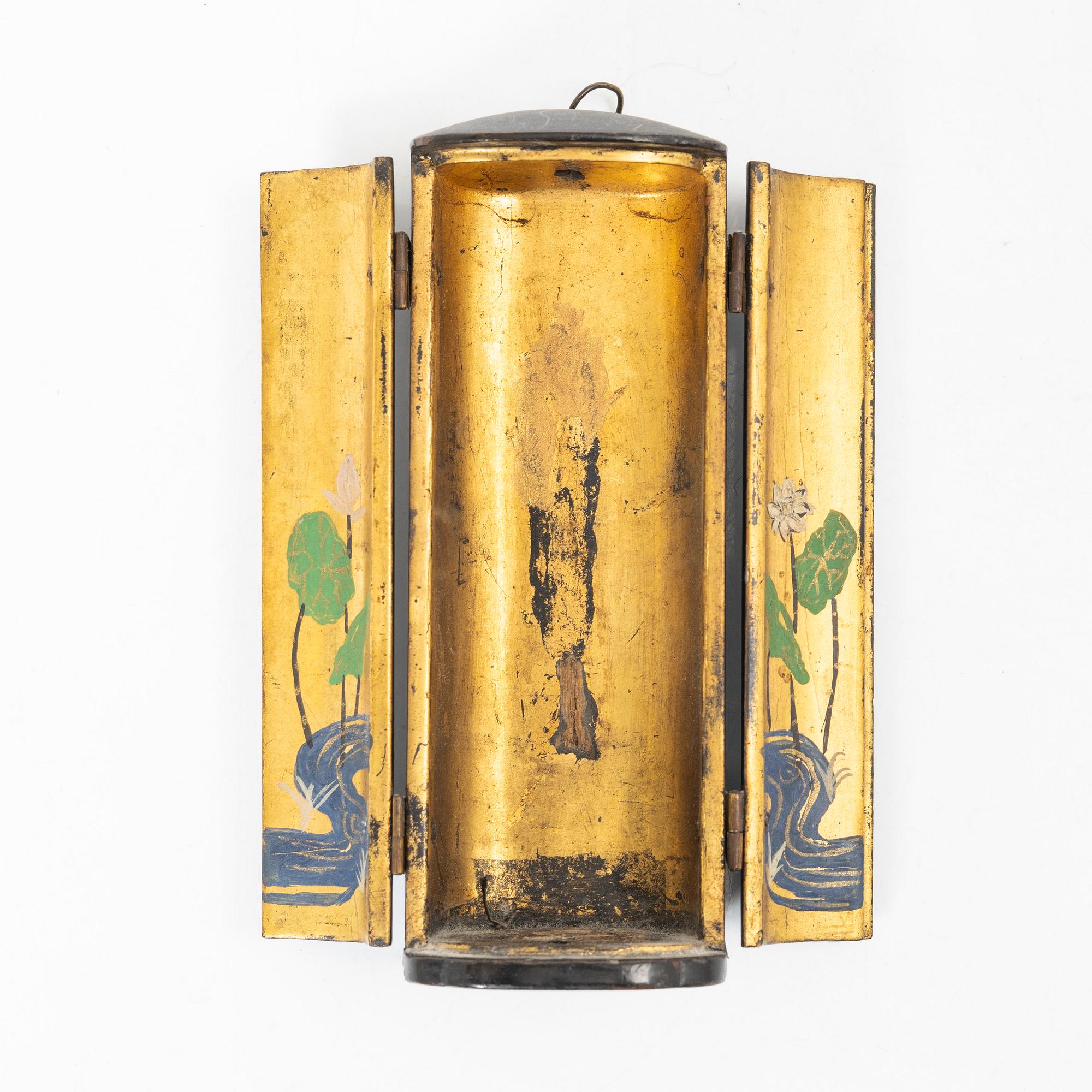 A portable buddhist altar and a figure of 'Weeping Buddha', Japan and Indonesia.