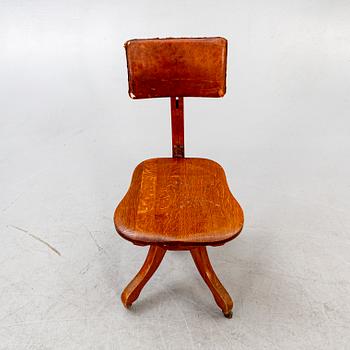 An early 1900s oak office chair.